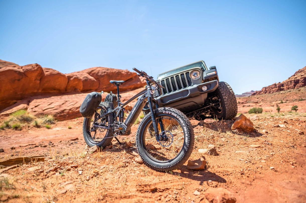 quietkat jeep ebike in front of jeep car