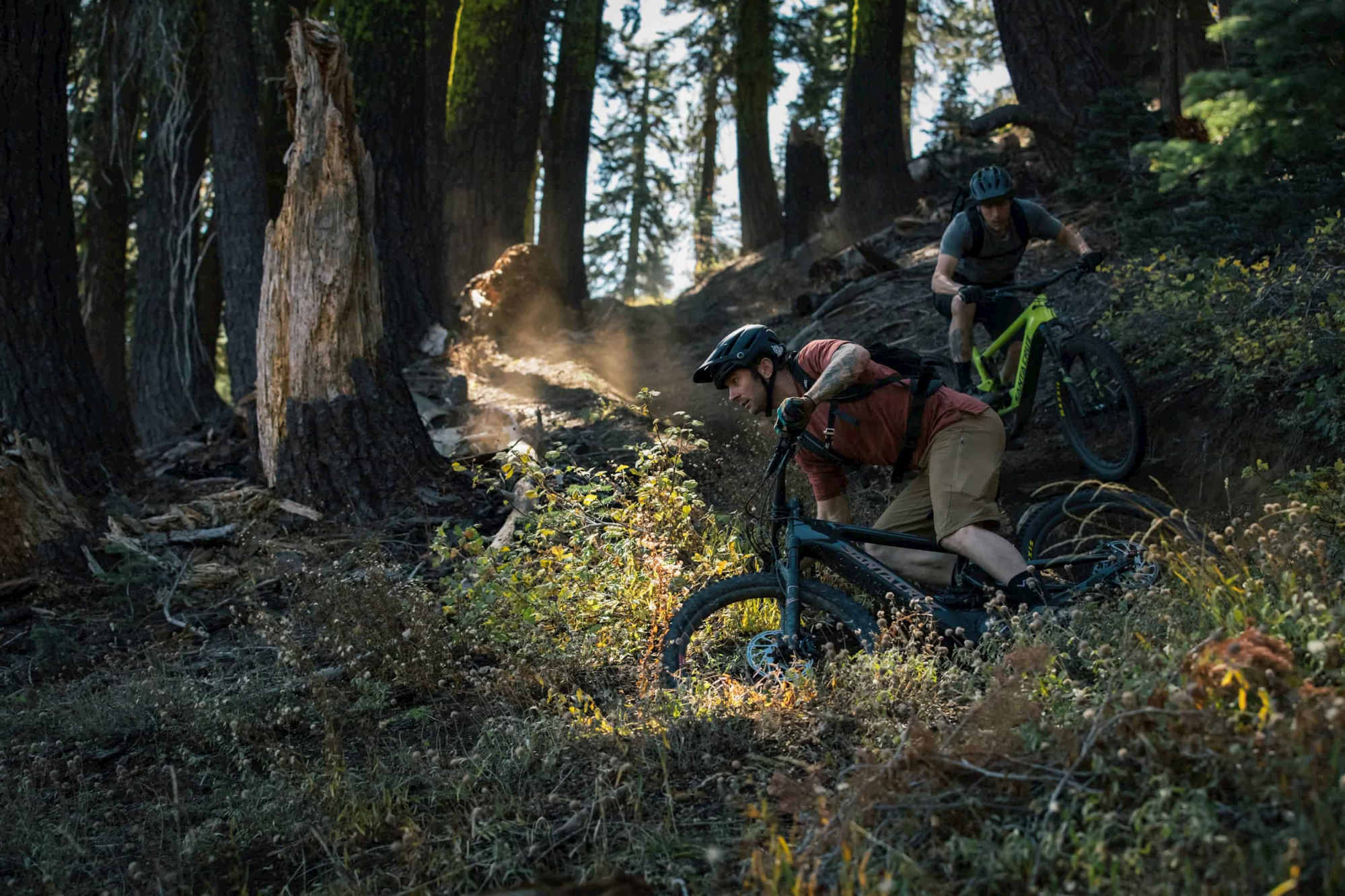 two men riding santa cruz electric bikes on a trail